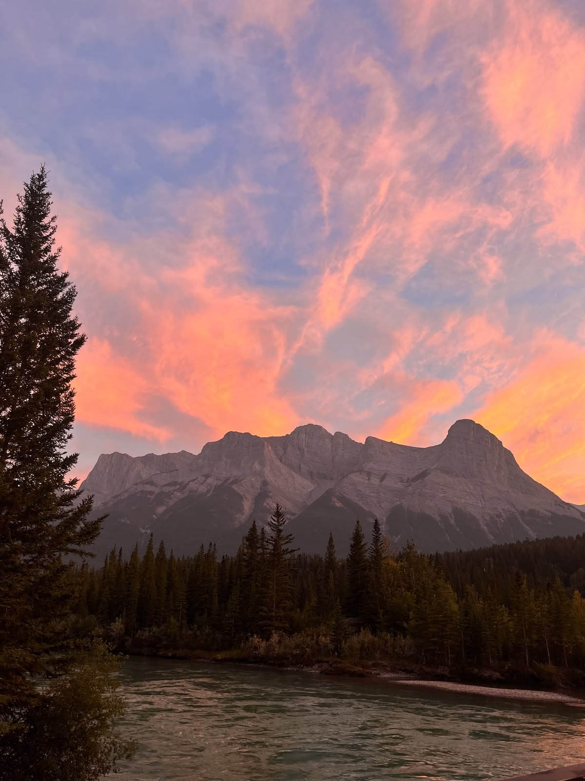 Dark silhouette of the Alberta Rocky Mountains at dusk